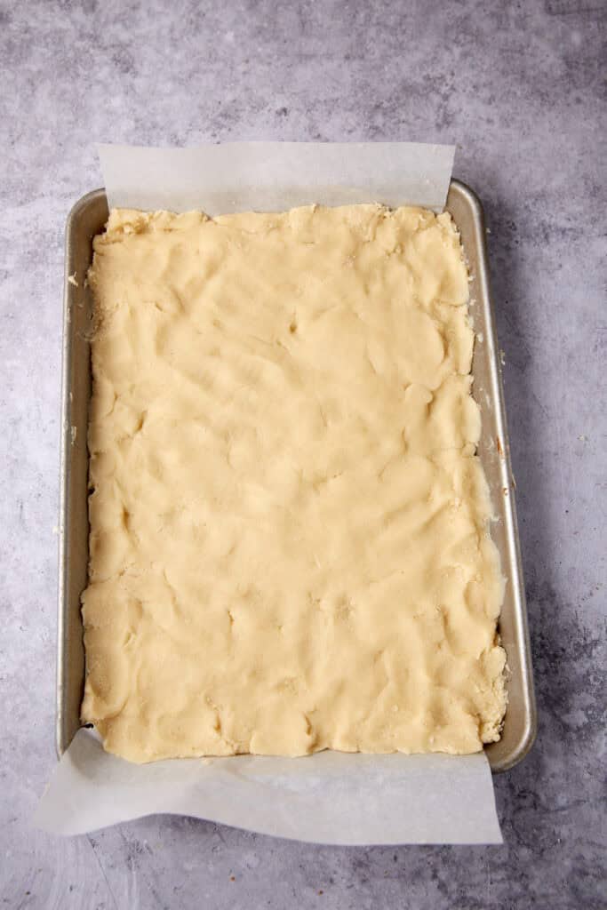 shortbread crust pressed into a baking pan.