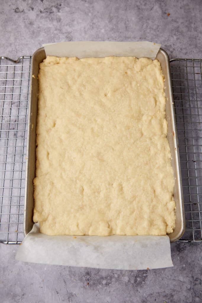 baked shortbread crust in a baking pan.