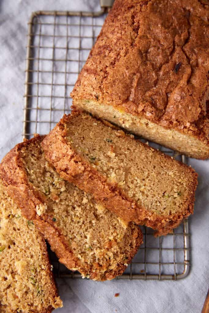 A sliced loaf of pineapple zucchini bread. 