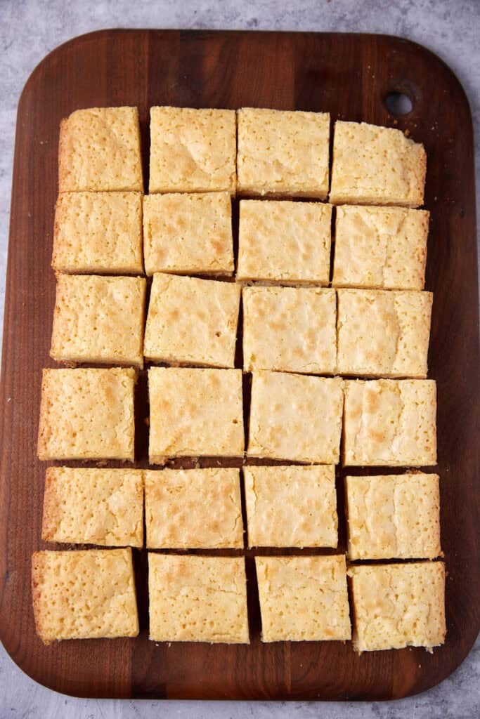 white chocolate brownies on a brown background.