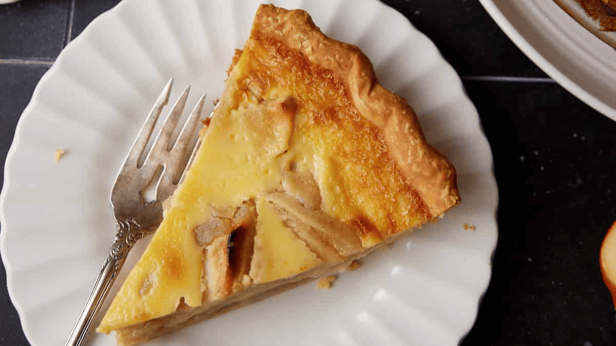 apple custard pie slice on a plate.