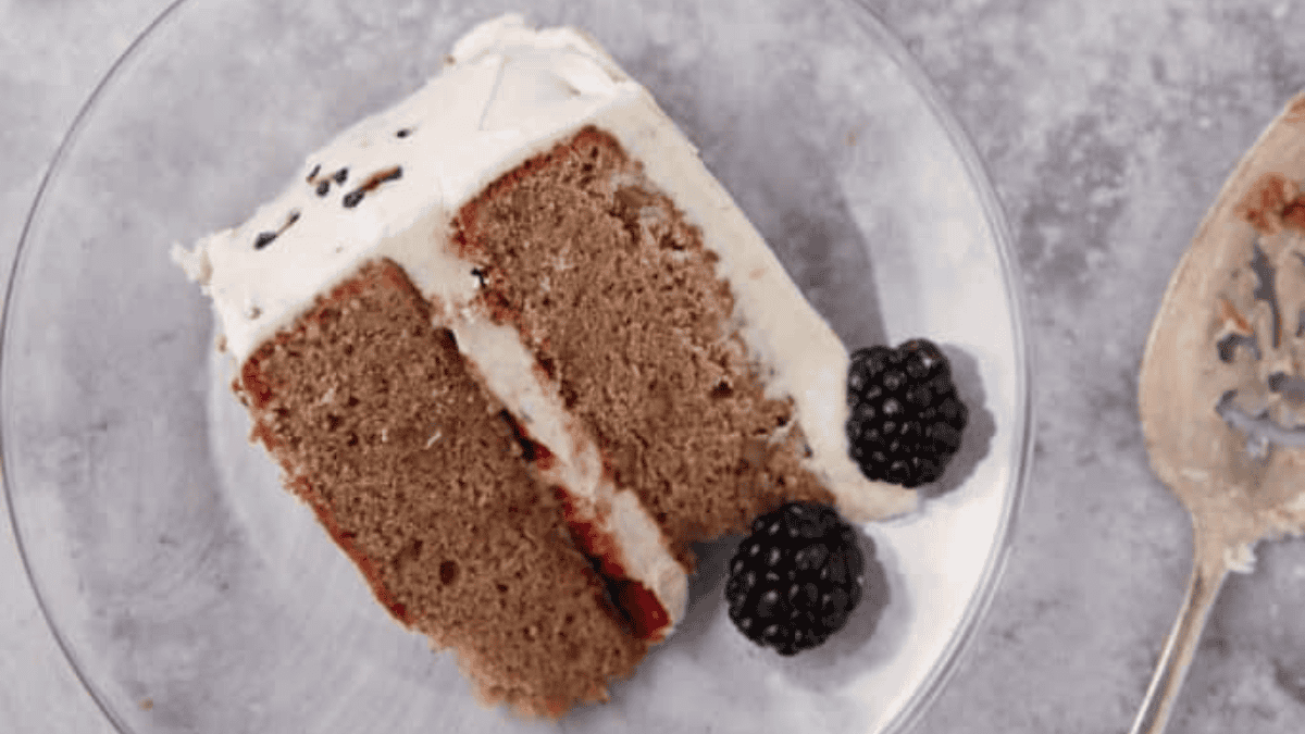blackberry jam cake slice on a plate.