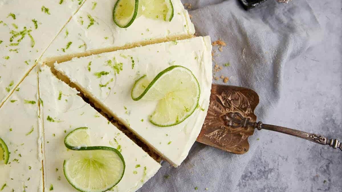Key lime pie slice being scooped.