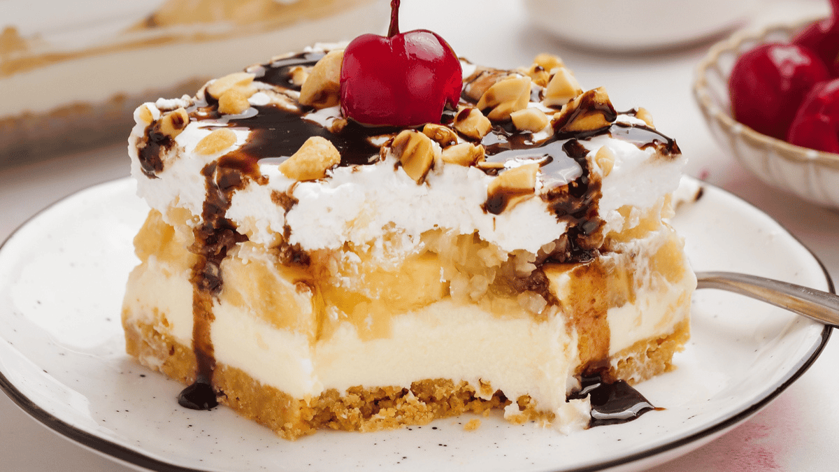 a slice of banana split cake on a plate.