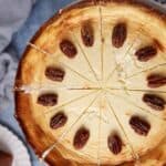 Pecans on the top of a cheesecake.