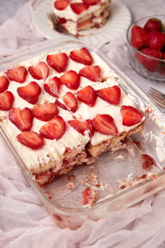 A square dish with strawberry tiramisu.