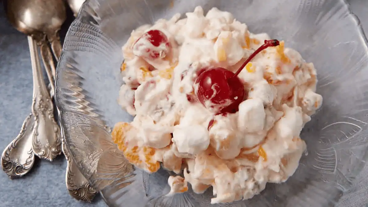 ambrosia salad in a clear glass bowl.