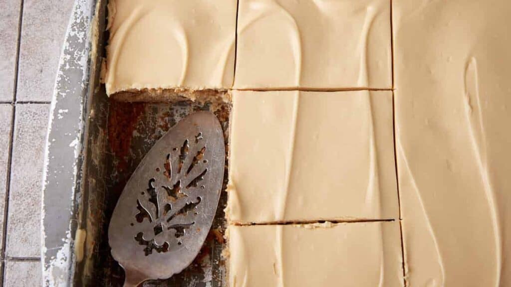 An apple sheet cake cut in a pan.