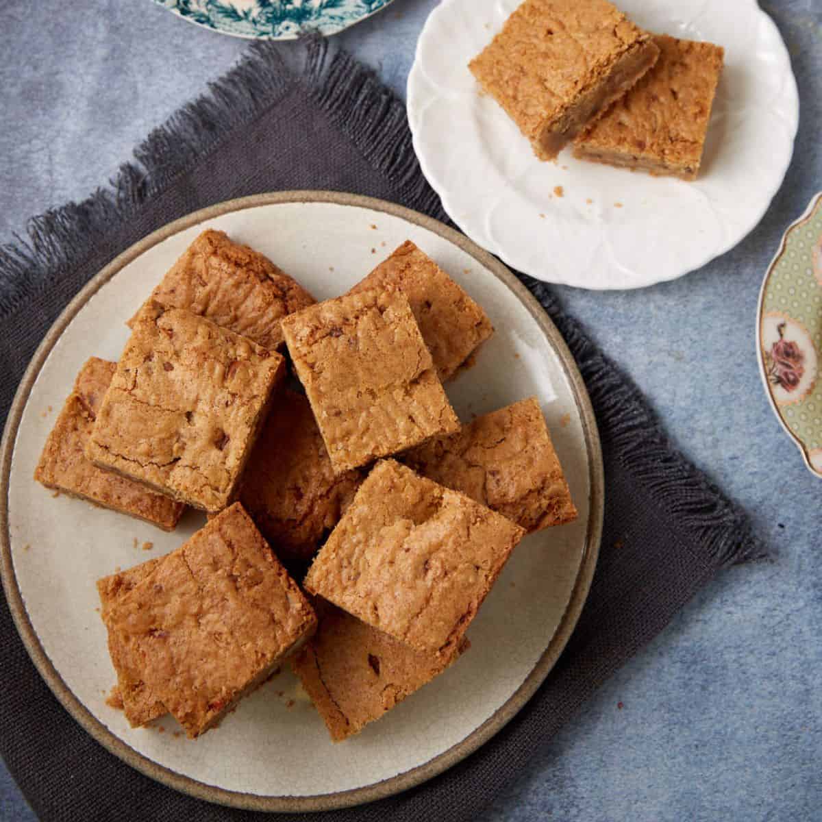 A platter of stacked brown butter blondies.