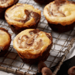 brownies cheesecake bites on a cooling rack.