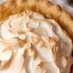 brown sugar pie with meringue on a white plate.