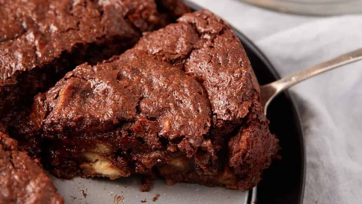 A slice of chocolate bread pudding on a serving spatula.