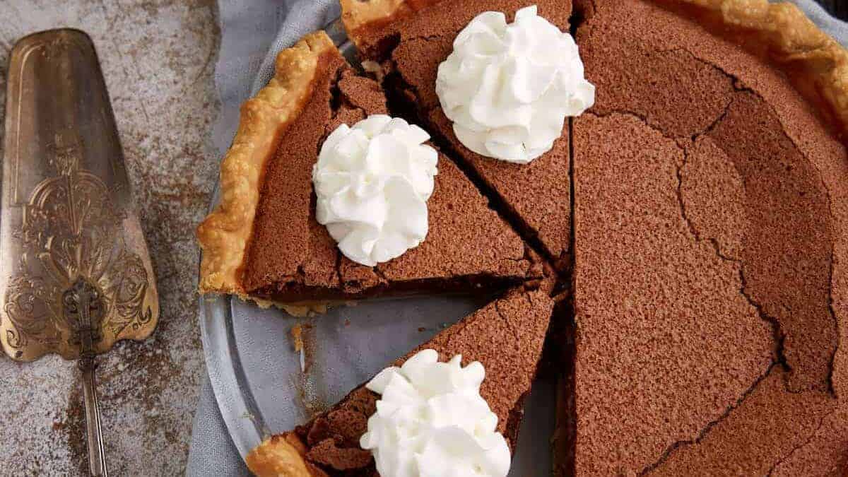 sliced chocolate chess pie on a plate.