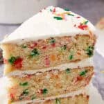 slice of confetti cake on a white plate.