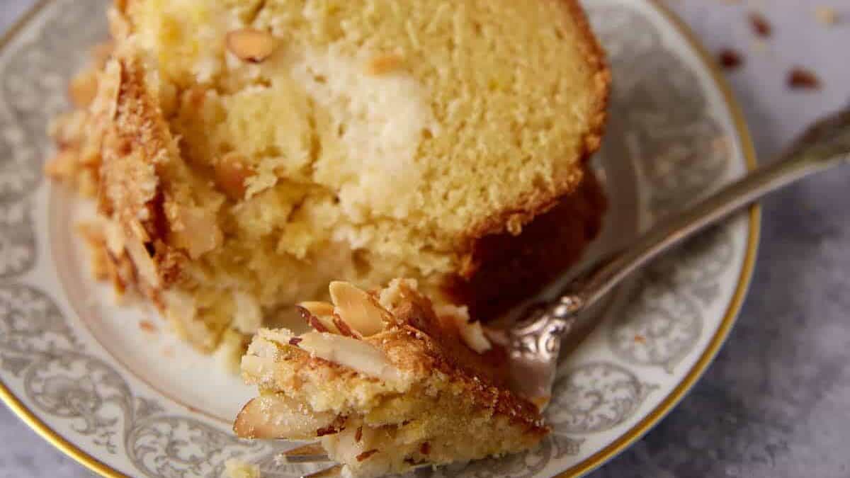 A slice of coffee cake with a bite taken out.