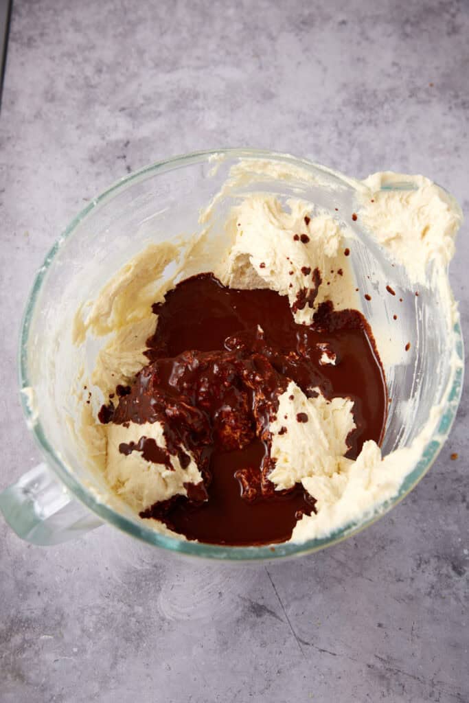 melted chocolate being added to the cake batter.
