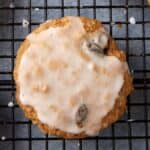 Iced oatmeal cookies on a wire rack.