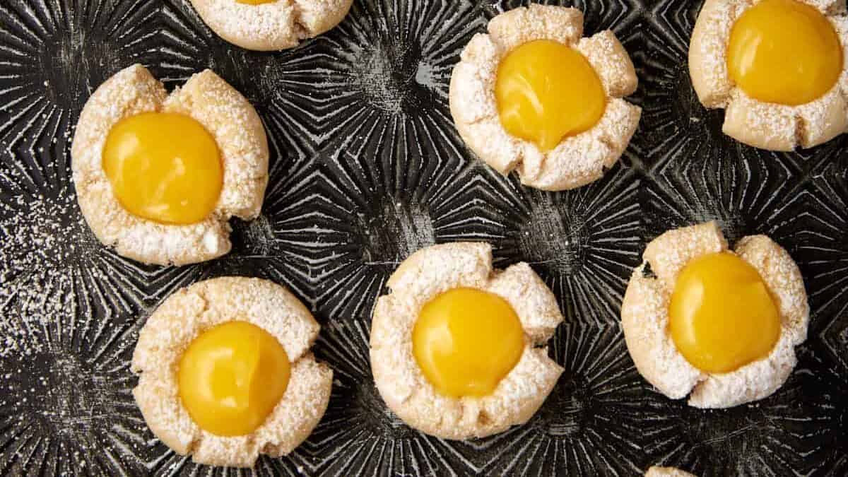 Lemon curd cookies on a tray.