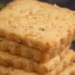 A stack of orange shortbread cookies.