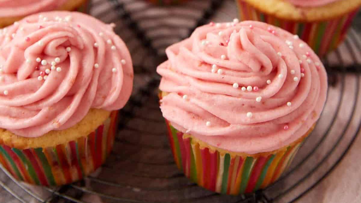raspberry cupcakes on a cupcake stand.