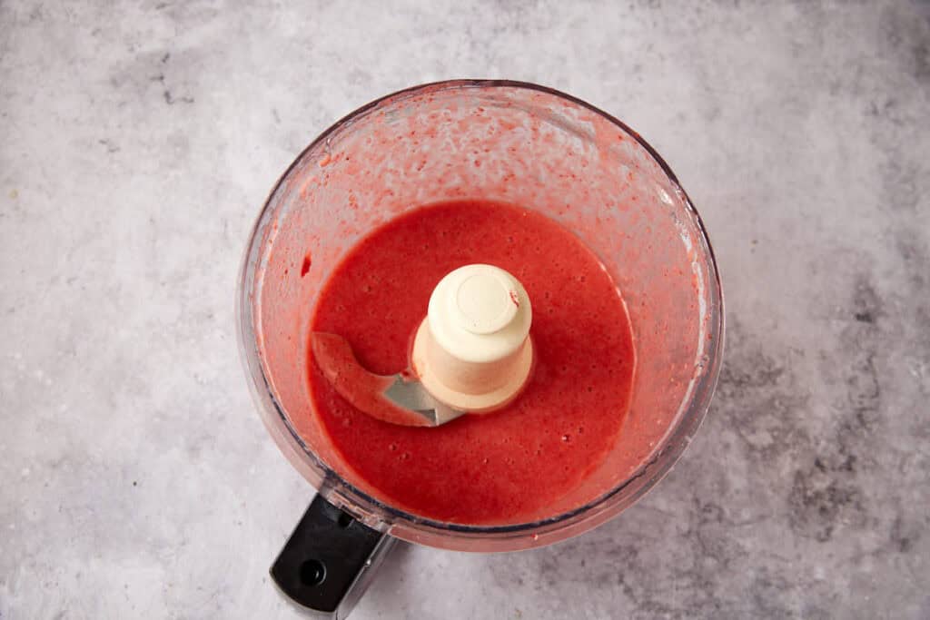 pureed strawberries in a food processor.