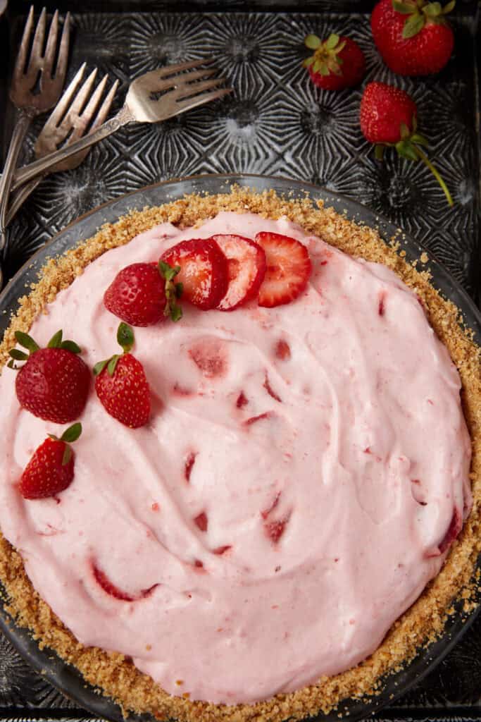 strawberry chiffon pie with a side of forks.