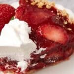 slice of strawberry icebox pie on a plate.