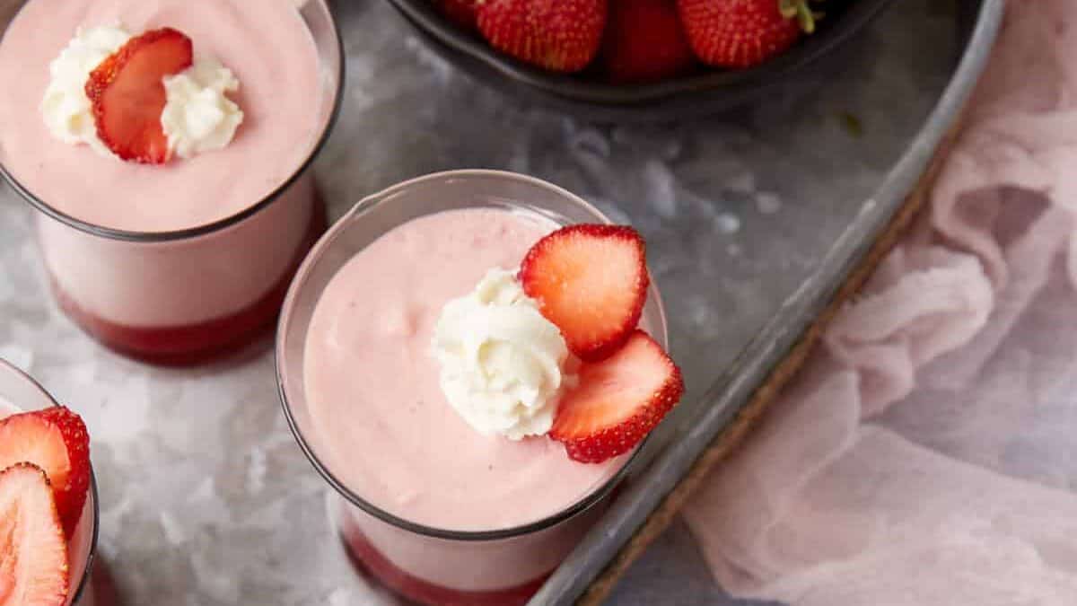 Four servings of white chocolate strawberry mousse.
