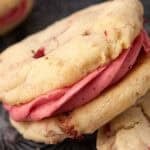 strawberry sandwich cookies on a dark background.