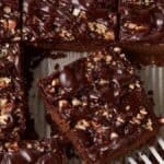 A spatula removing a piece of chocolate cake.