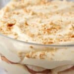 A glass bowl with layers of banana pudding.