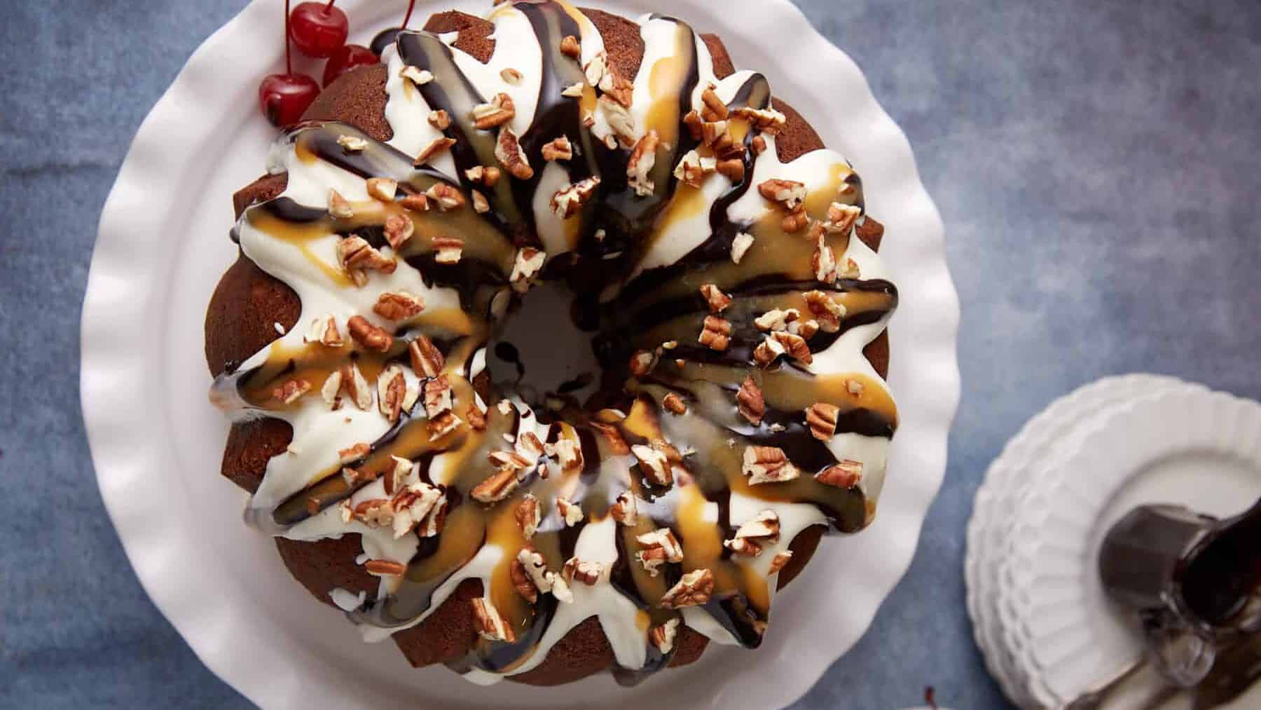A banana split cake covered in toppings.