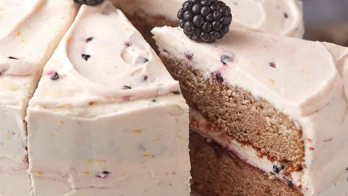 a piece of blackberry jam cake being lifted out.