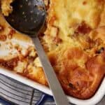 Bread pudding servings on white plates.