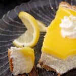 A bite taken out of a slice of lemon pie.