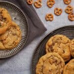 peanut butter pretzel cookies on a plate with a plate of cookies and pretzels on the side.