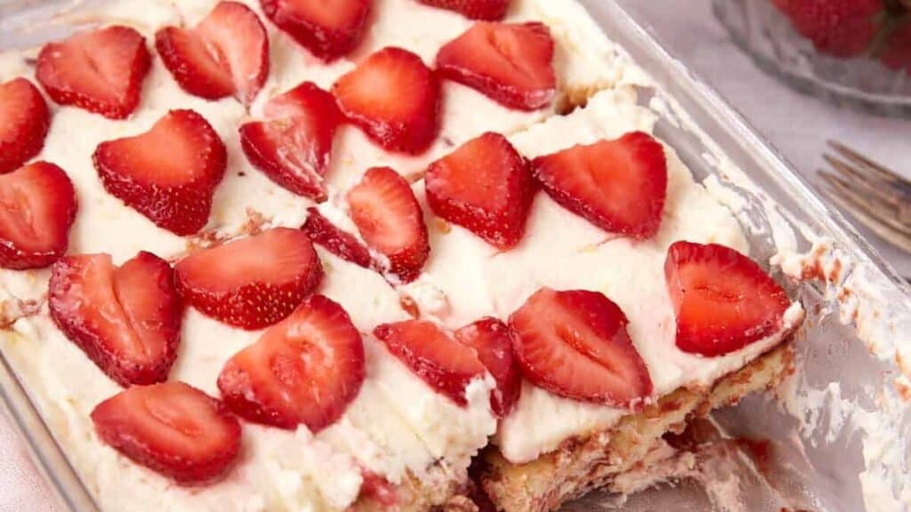 A square dish with strawberry tiramisu.