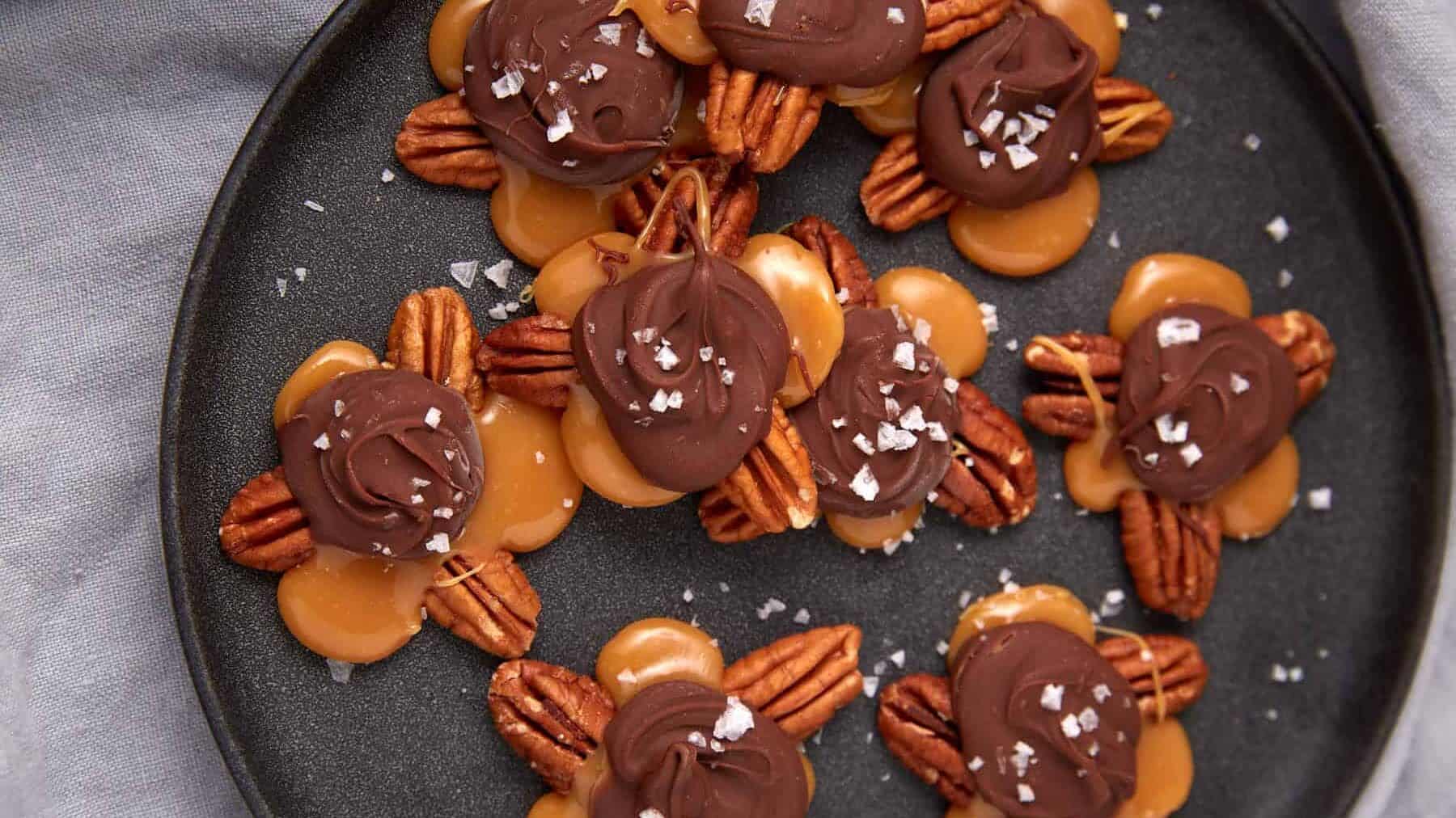 turtle candies on a round black plate.