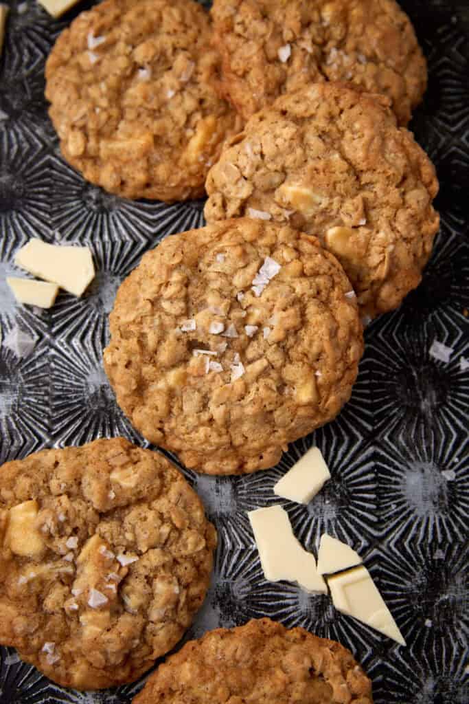 white chocolate oatmeal cookies on a dark background.