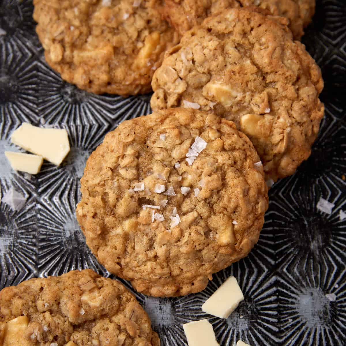 white chocolate oatmeal cookies on a dark background.