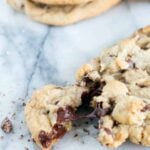 A chocolate chip cookie broken in half.