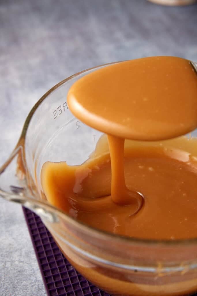 caramel sauce with a spoon in it.