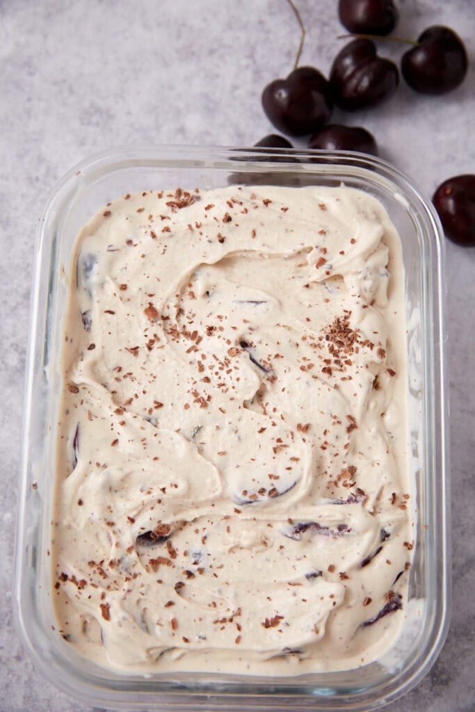 cherry chocolate ice cream in a glass serving dish.