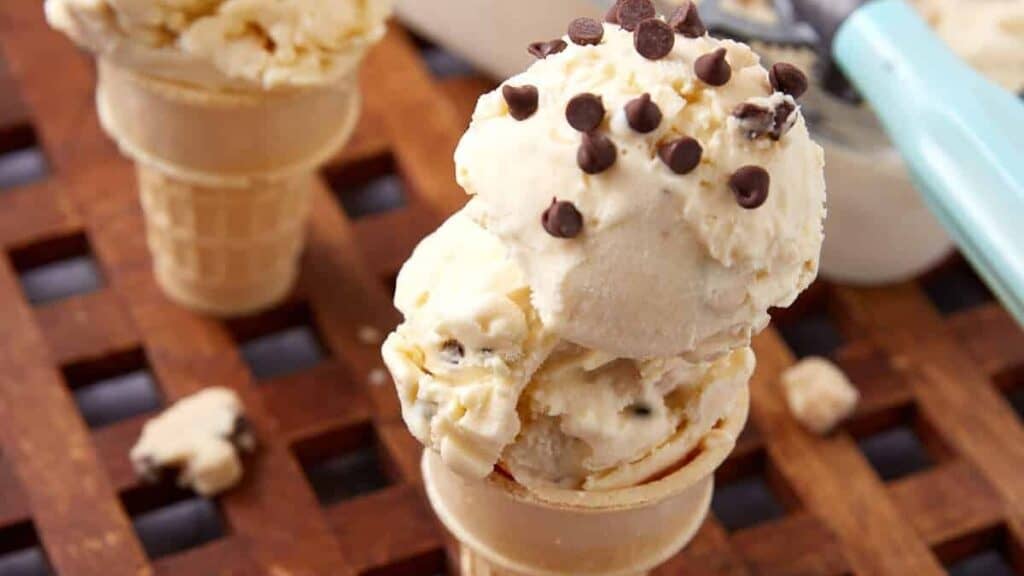 two cones with two scoops each of chocolate chip cookie dough ice cream.