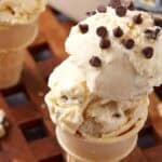 two cones with two scoops each of chocolate chip cookie dough ice cream.