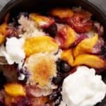 peach cobbler cake in a bowl.