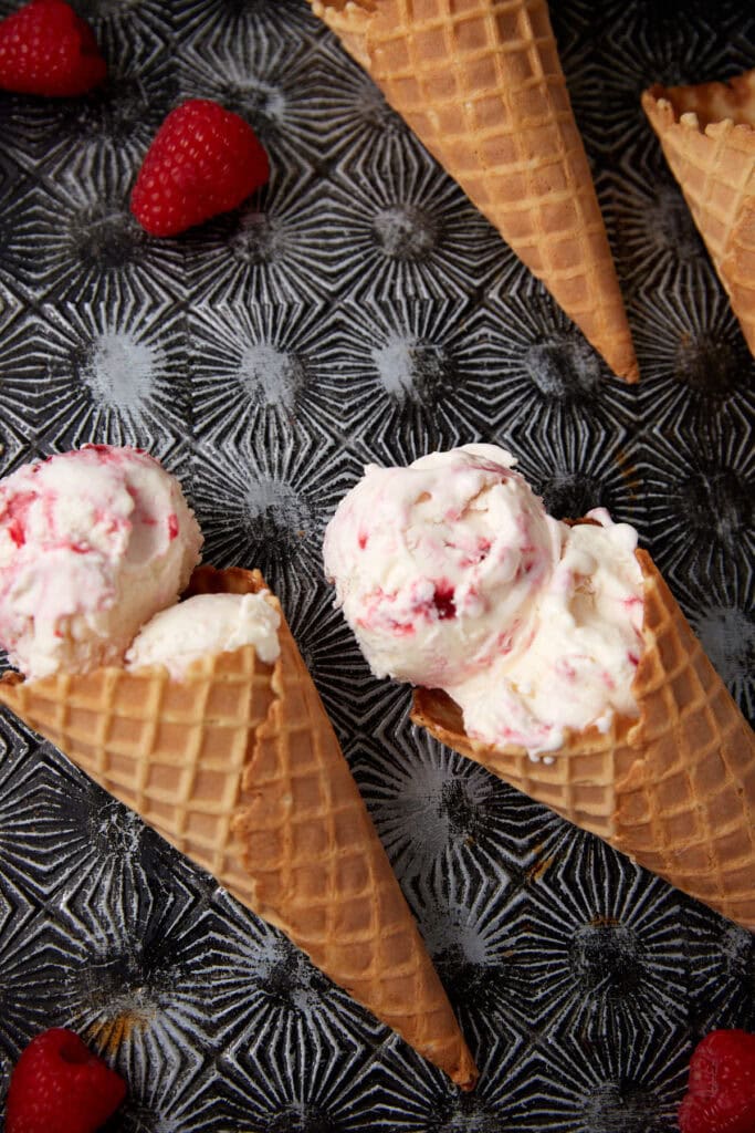 raspberry swirl ice cream in waffle cones.