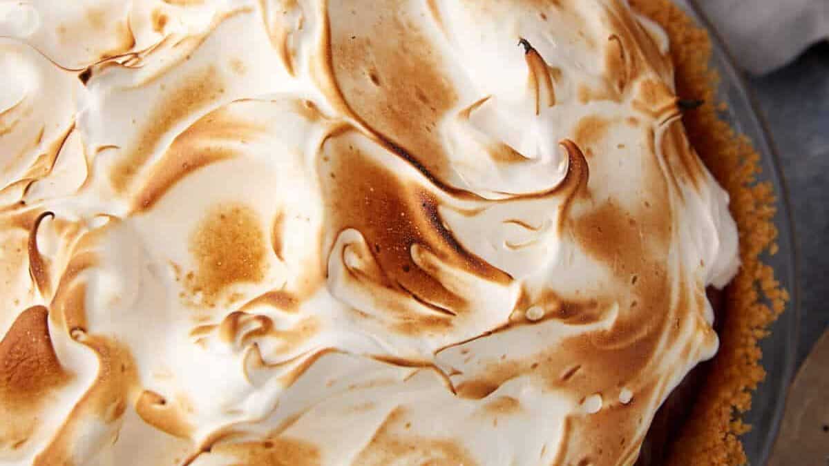 A marshmallow frosting on a chocolate pie.