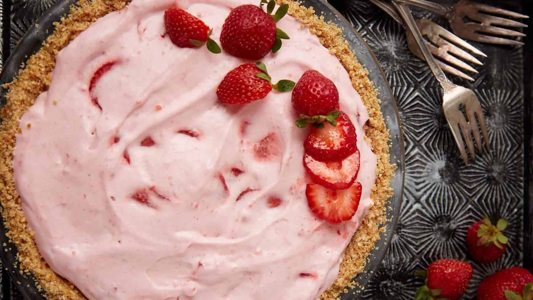 strawberry chiffon pie with a side of forks.