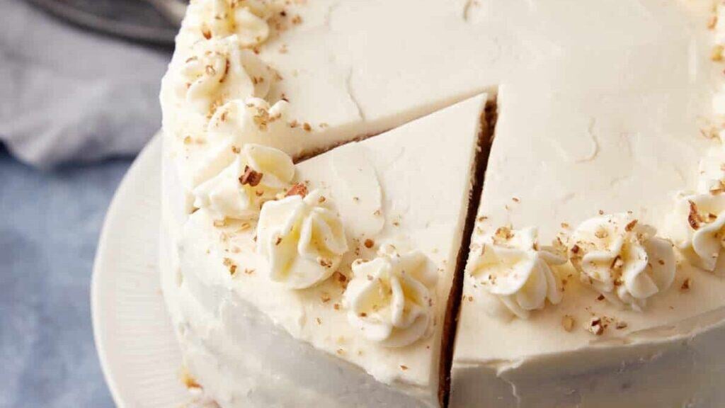 A sweet potato cake with a slice cut.